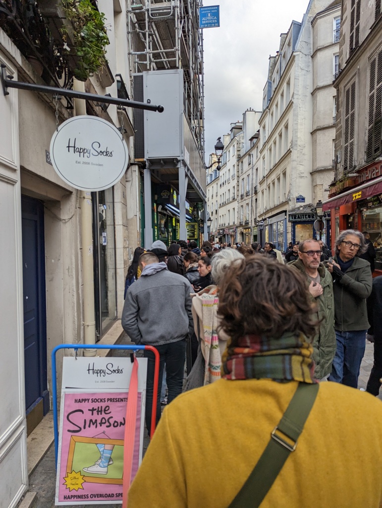 long line of people outside a falafel restaurant in Paris France